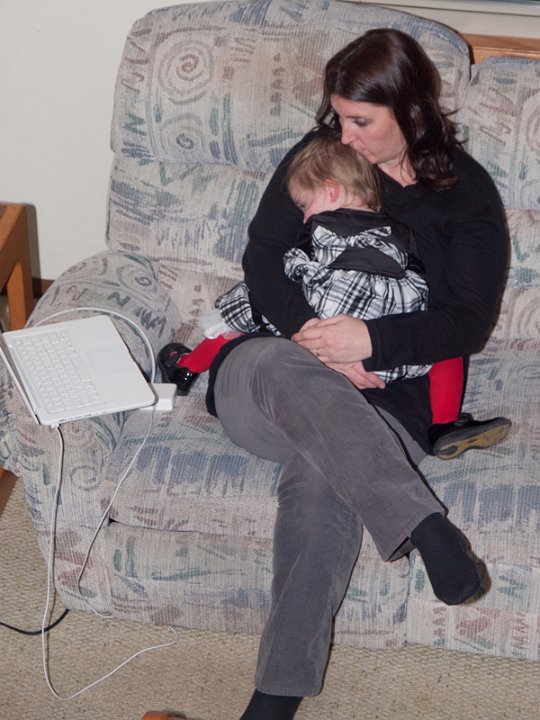 PC242670.jpg - They are snuggling and tracking Santa on the NORAD website