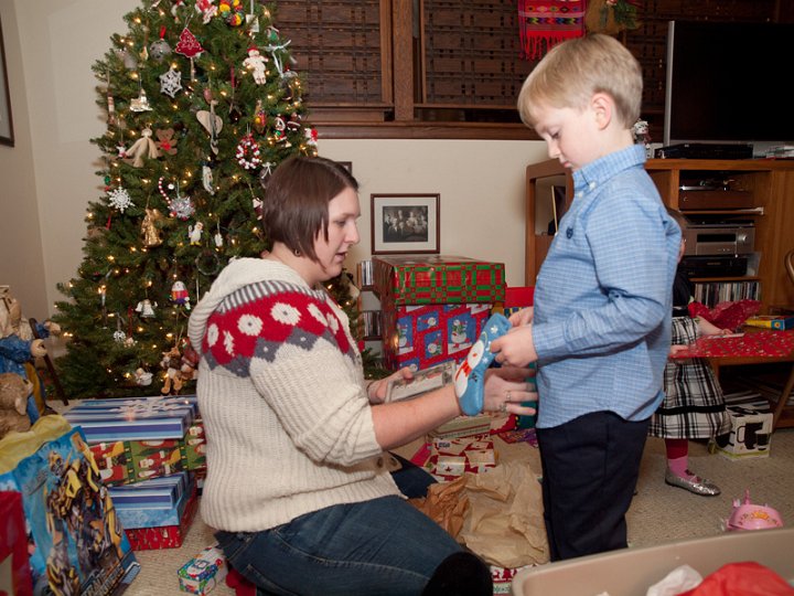 PC242687.jpg - Caleb assisted Aunti Lindsay in distributing gifts